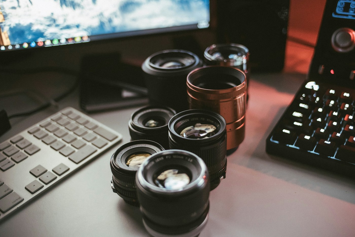 Camera lenses arranged on a creative workstation